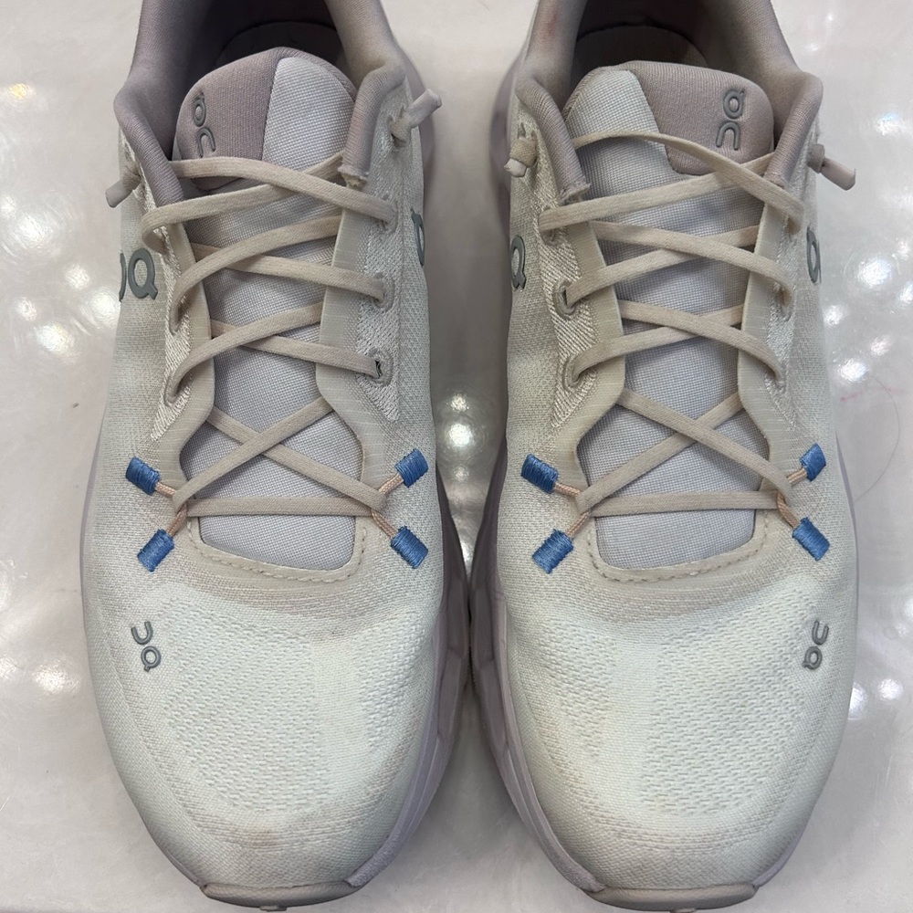 On Running White and Blue Athletic Shoes with Mesh Upper